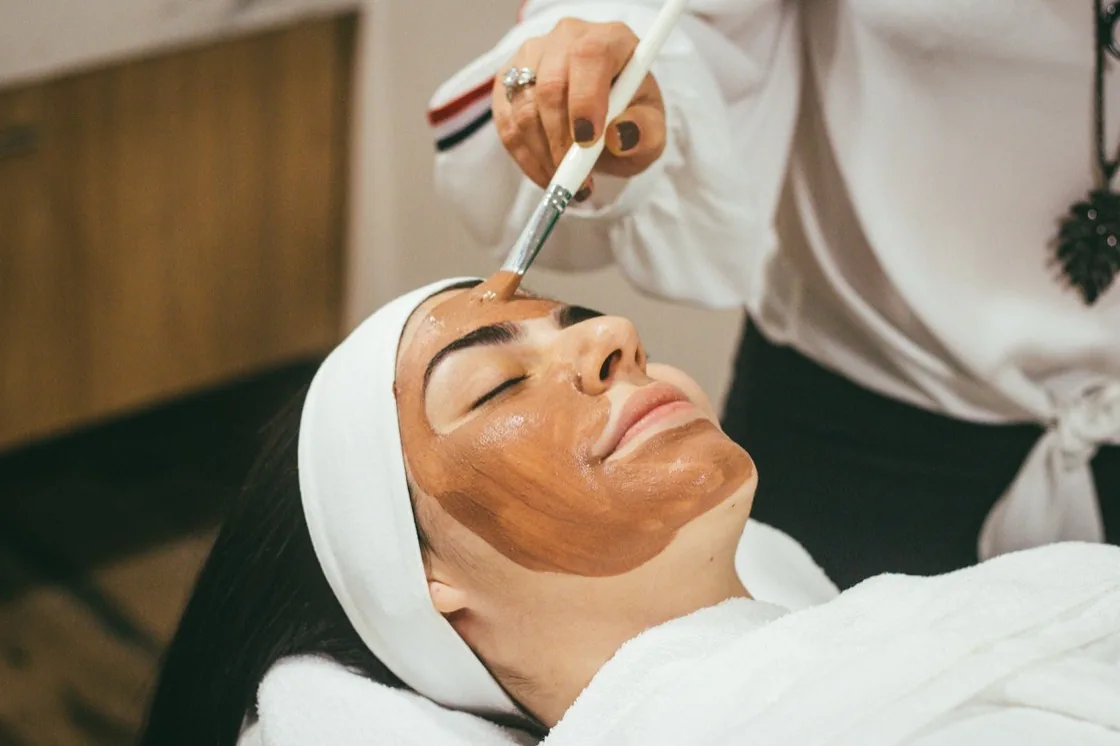 Therapist applying a facial mask